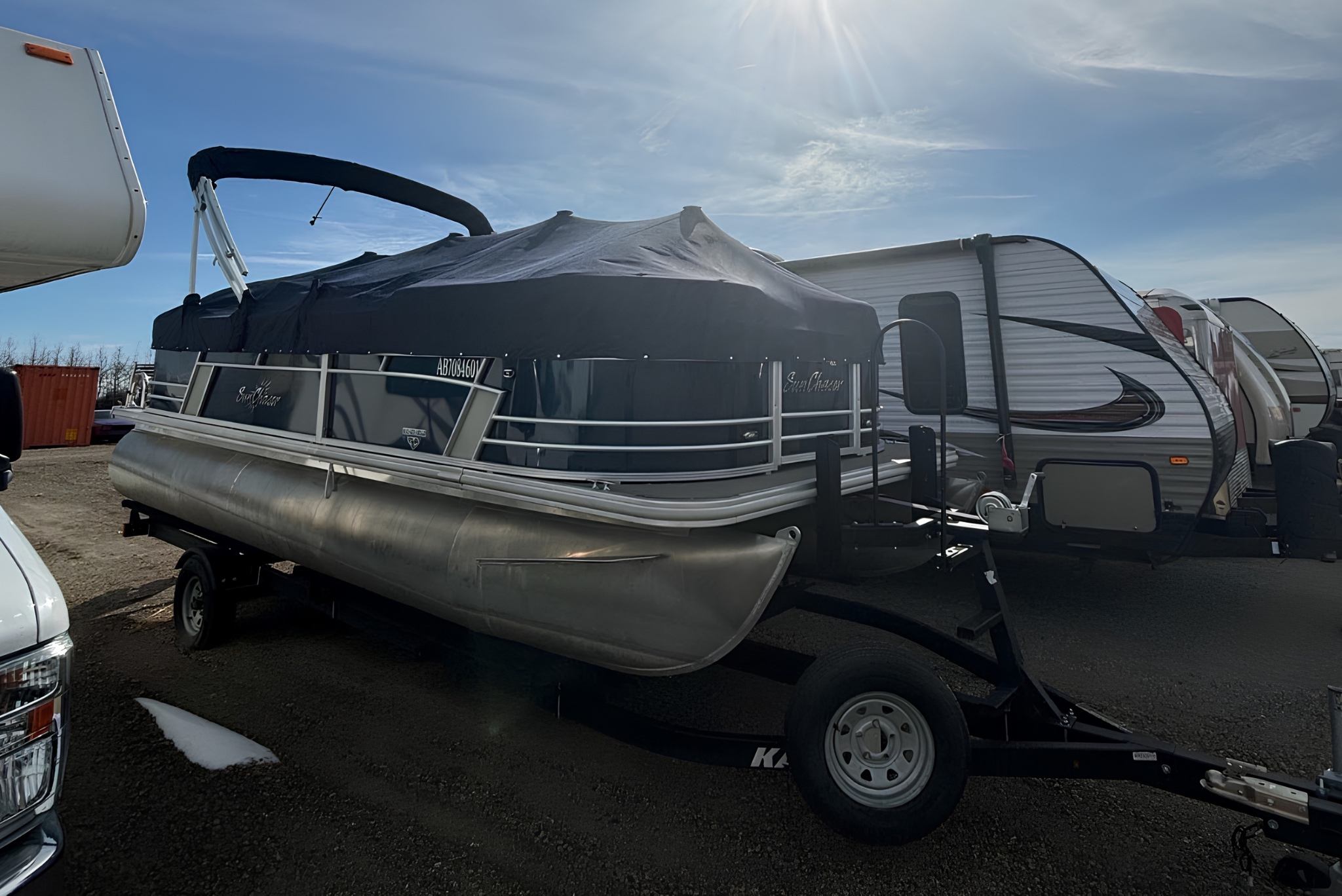 Boats parked in secure outdoor storage lot at Wheeler’s RV & Boat Storage